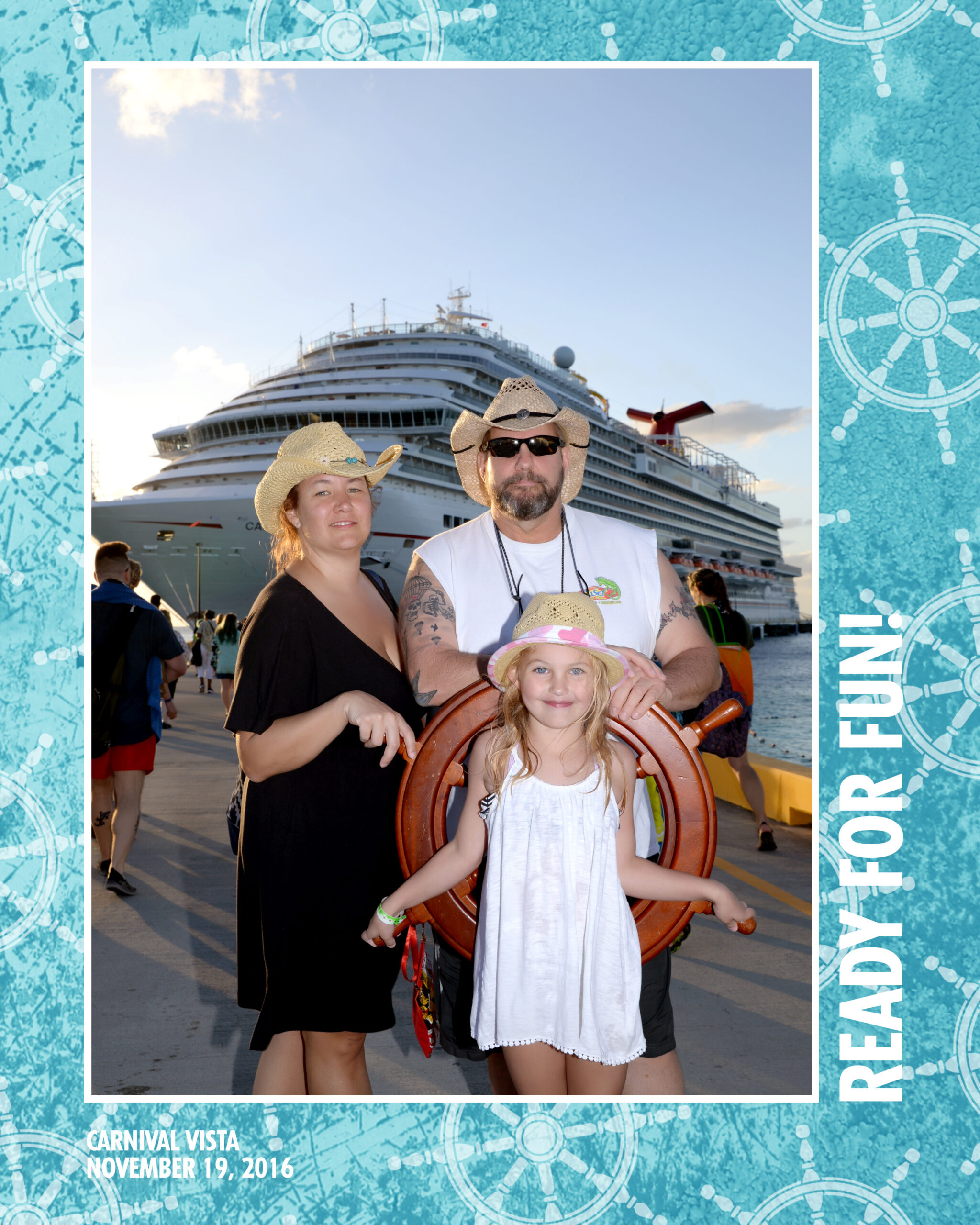 Family portrait at a cruise port with a Carnival Vista ship in the background, featuring a woman, a man, and a young girl holding a ship's wheel. The scene captures a fun vacation spirit, with the trio wearing summer hats and smiles, suggesting a joyful cruise experience on November 19, 2016.